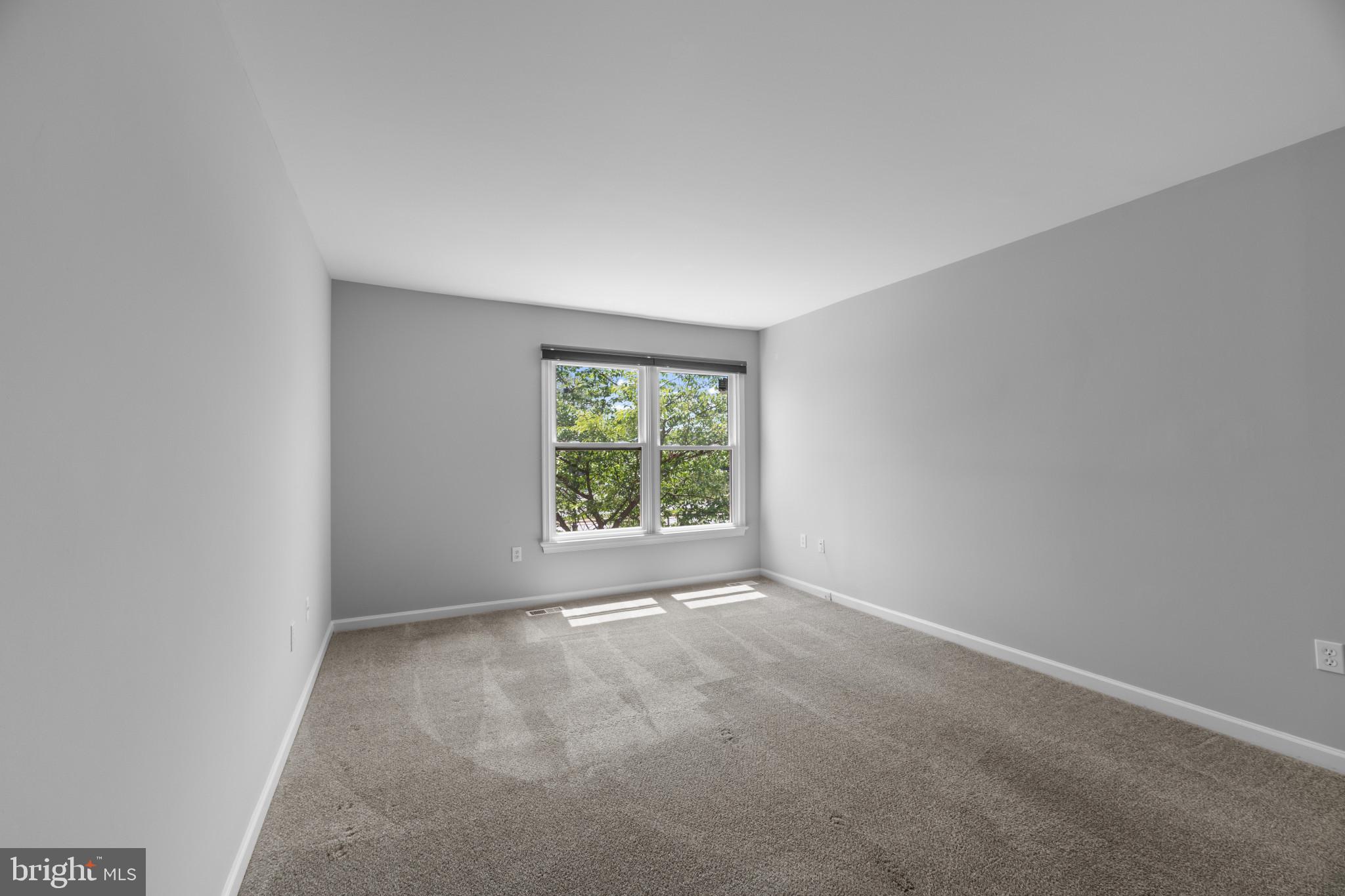 9302 Player Drive, Unit 155 Laurel, MD 20708 - Photo 22 of 43 an empty room with windows