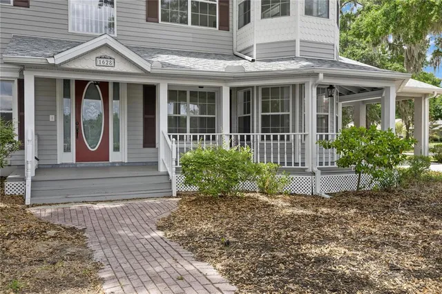 a view of a house with porch and wooden floor
