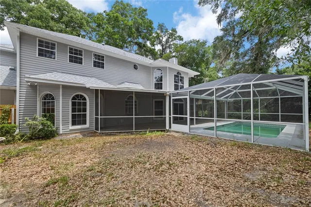 a kitchen with granite countertop white cabinets and a sink