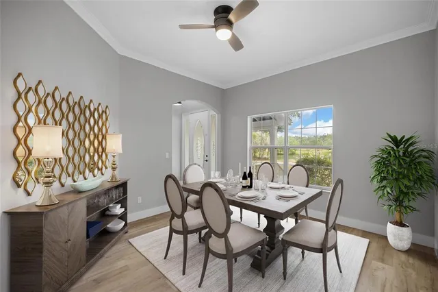 a large kitchen with cabinets stainless steel appliances a sink and a window