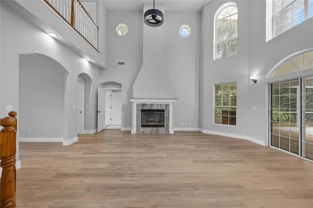 a bedroom with a large bed and a large window