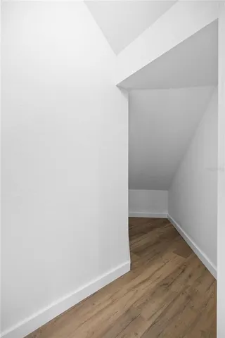 a view of a hallway with windows