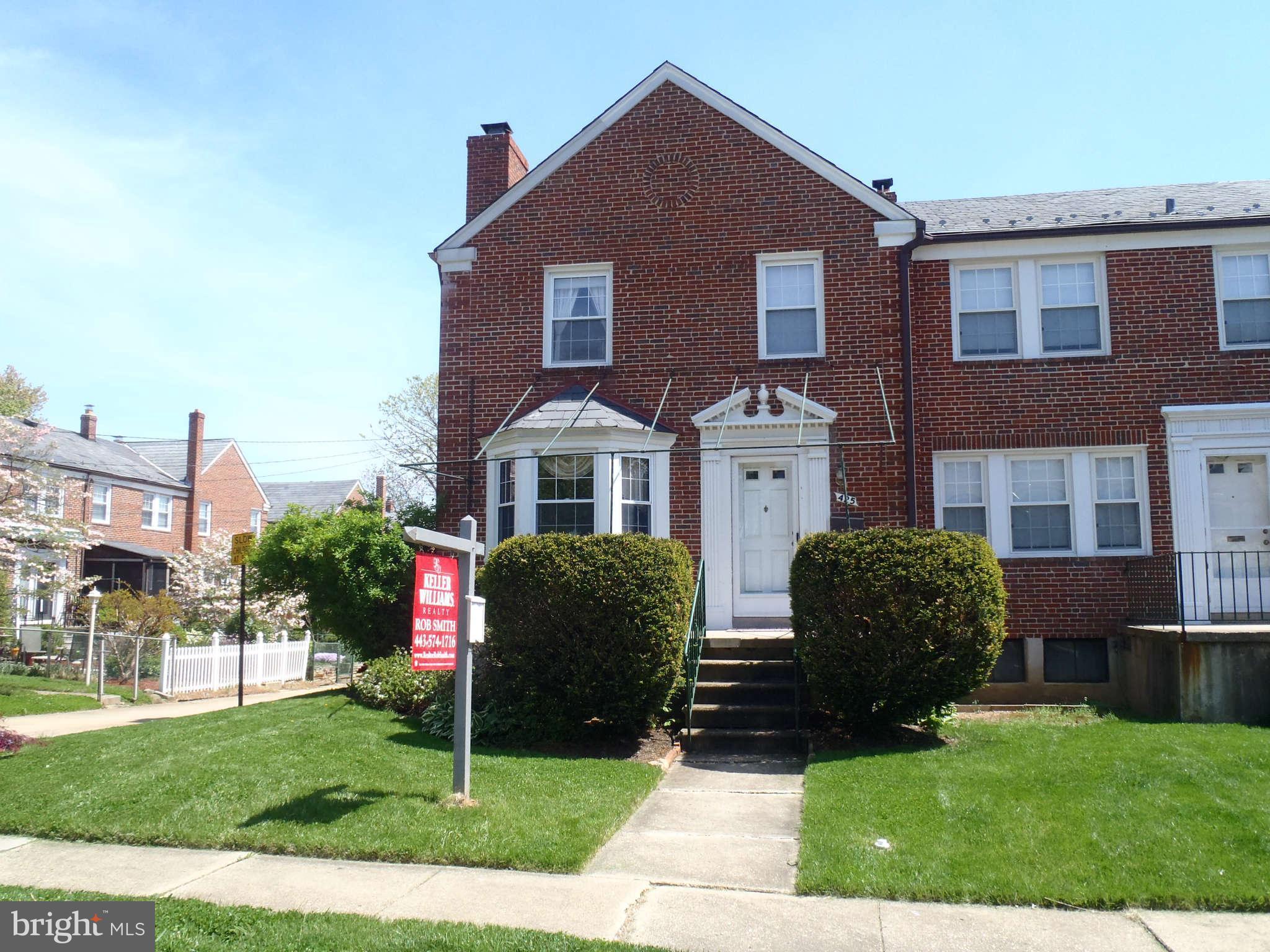 425 Lambeth Road Baltimore, MD 21228 - Photo 1 of 12 a front view of a house with garden