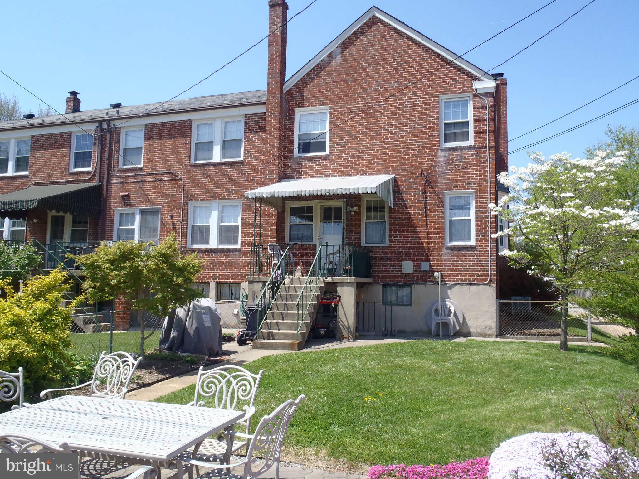 425 Lambeth Road Baltimore, MD 21228 - Photo 12 of 12 a view of house with a backyard and furniture