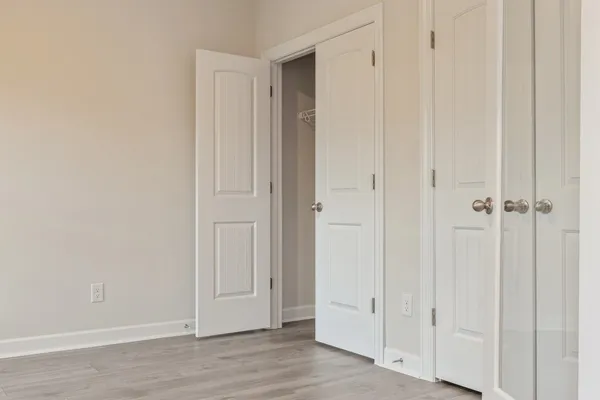 an empty room with wooden floor