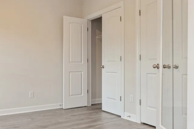 an empty room with wooden floor