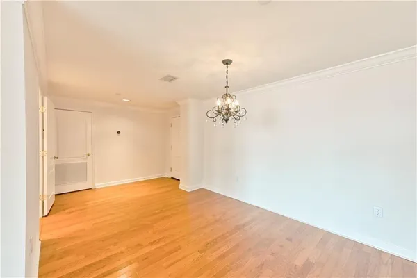 a view of empty room with a ceiling fan
