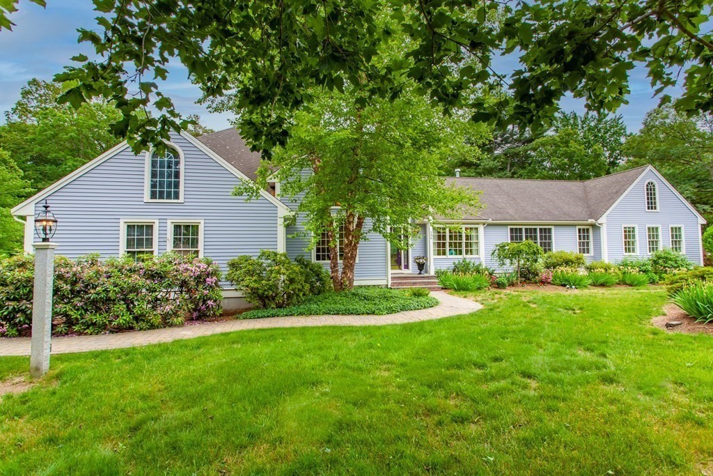 106 Hidden Valley Road Groton, MA 01450 - Photo 1 of 40 a front view of a house with a yard and porch