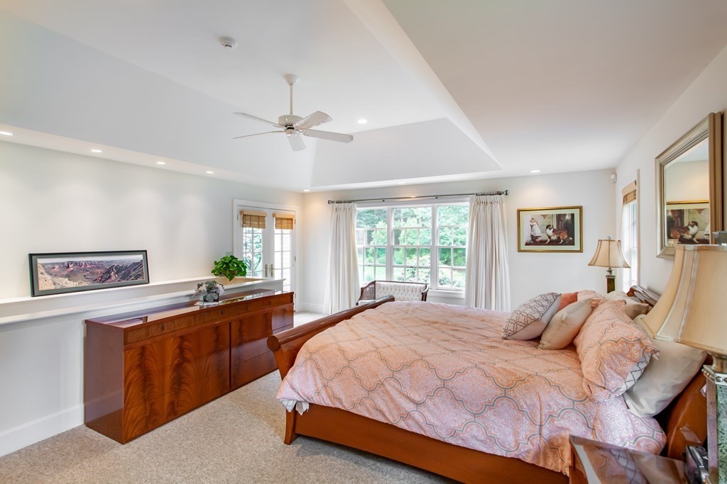 106 Hidden Valley Road Groton, MA 01450 - Photo 18 of 40 a bedroom with a large bed and a window