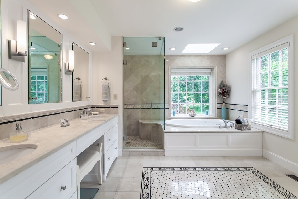 106 Hidden Valley Road Groton, MA 01450 - Photo 20 of 40 a spacious bathroom with a tub sink and a mirror