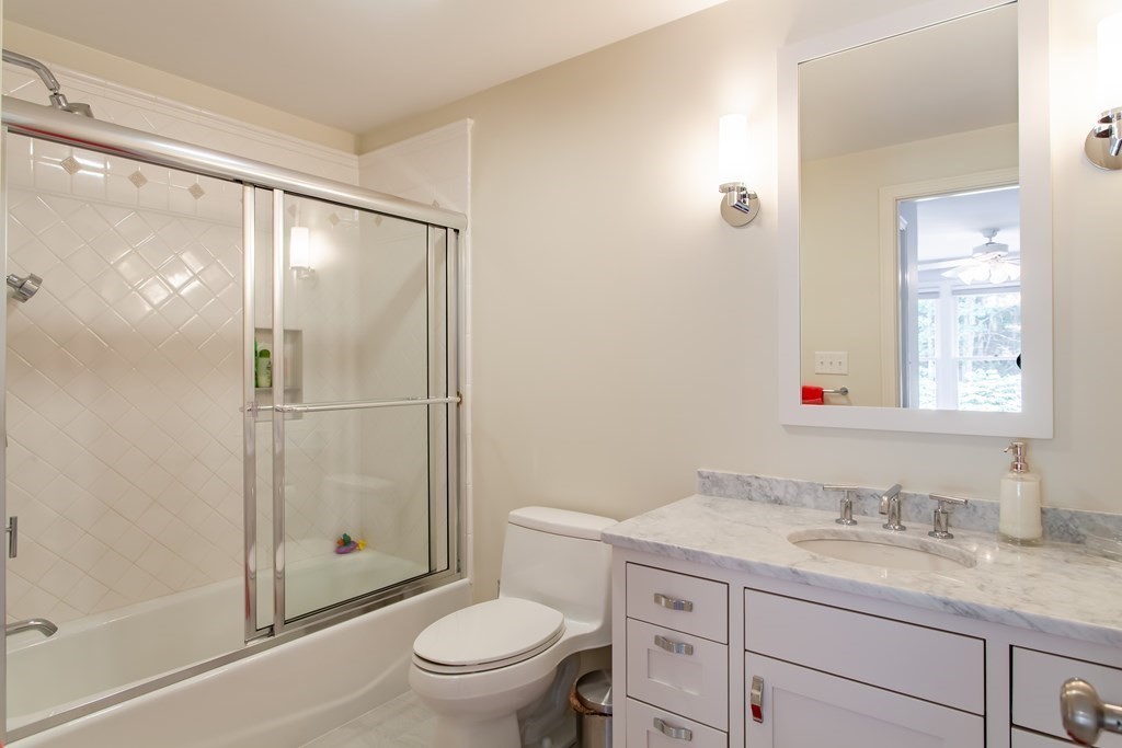 106 Hidden Valley Road Groton, MA 01450 - Photo 24 of 40 a bathroom with a granite countertop sink toilet and shower