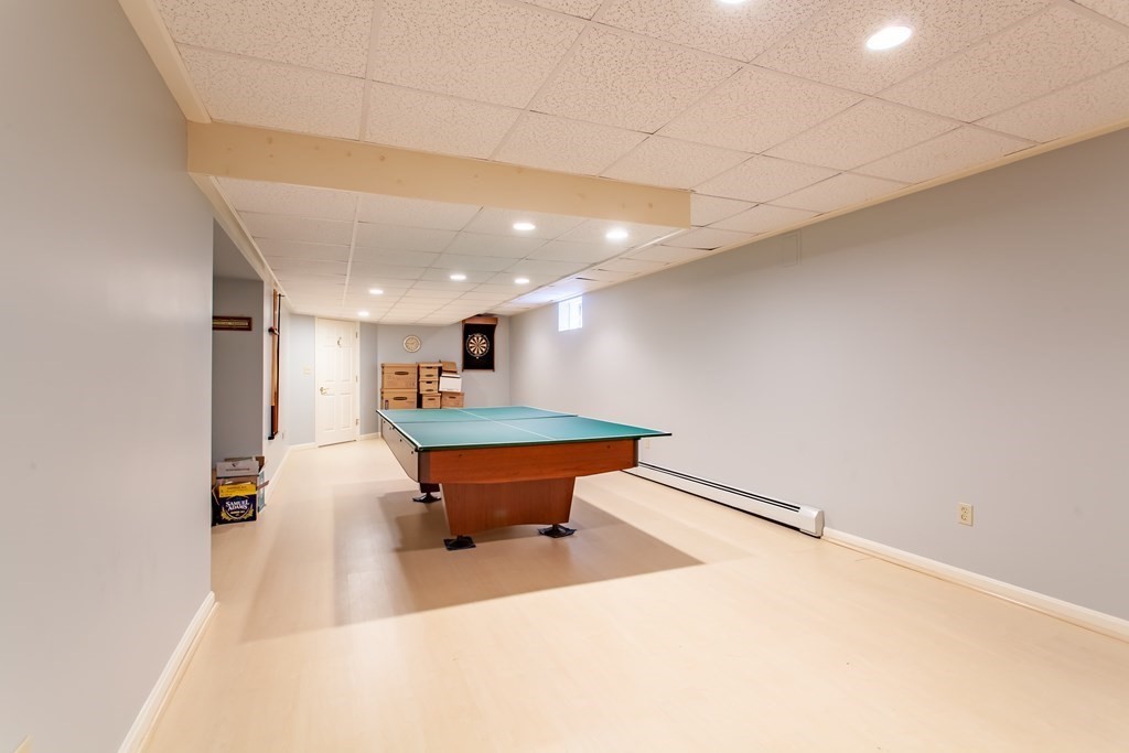 106 Hidden Valley Road Groton, MA 01450 - Photo 30 of 40 a room with pool table table and chairs