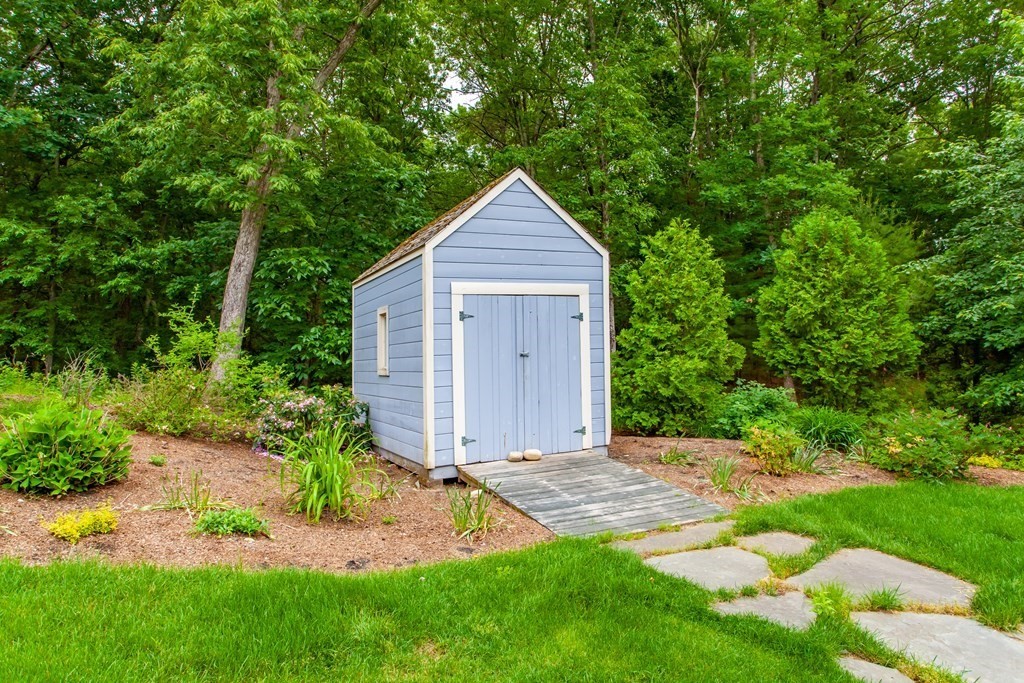 106 Hidden Valley Road Groton, MA 01450 - Photo 34 of 40 a view of house with backyard and garden