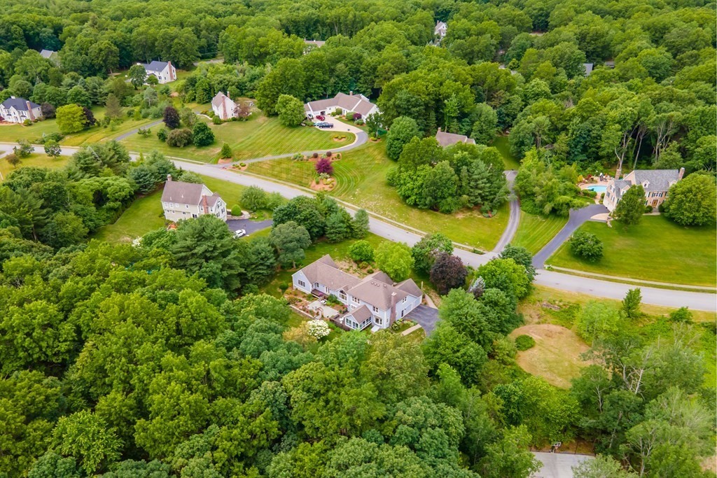 106 Hidden Valley Road Groton, MA 01450 - Photo 37 of 40 an aerial view of a house with a yard and lake view