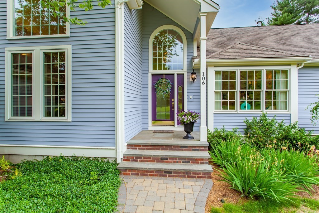 106 Hidden Valley Road Groton, MA 01450 - Photo 4 of 40 a front view of a house with a garden