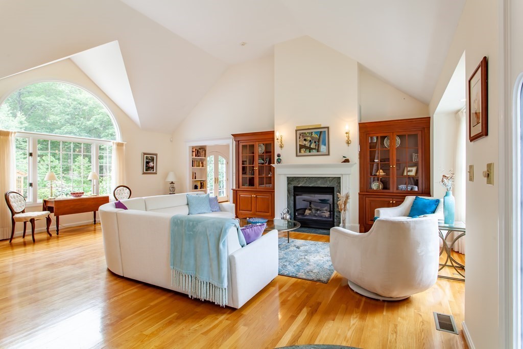 106 Hidden Valley Road Groton, MA 01450 - Photo 5 of 40 a living room with furniture and a fireplace