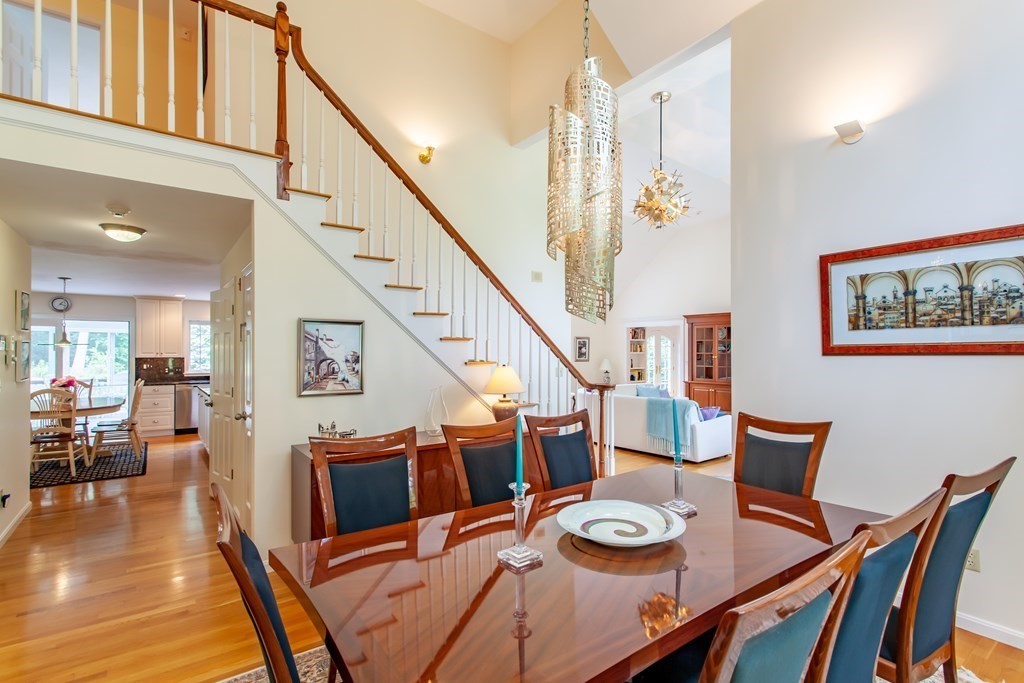 106 Hidden Valley Road Groton, MA 01450 - Photo 8 of 40 a view of a dining room with furniture and wooden floor