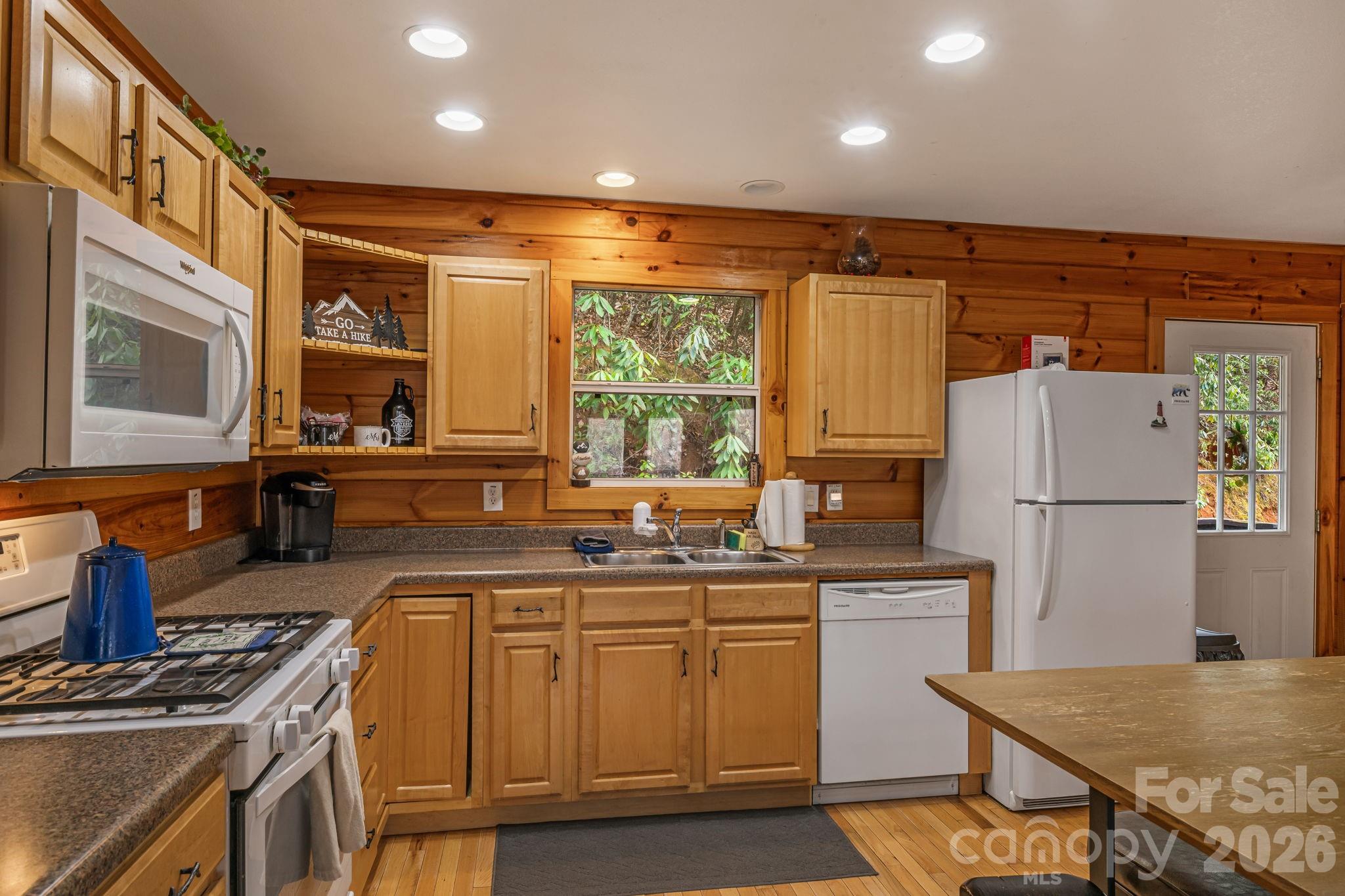 157 Crosspatch Lane Bryson City, NC 28713 - Photo 11 of 38 a kitchen with a sink stove and refrigerator