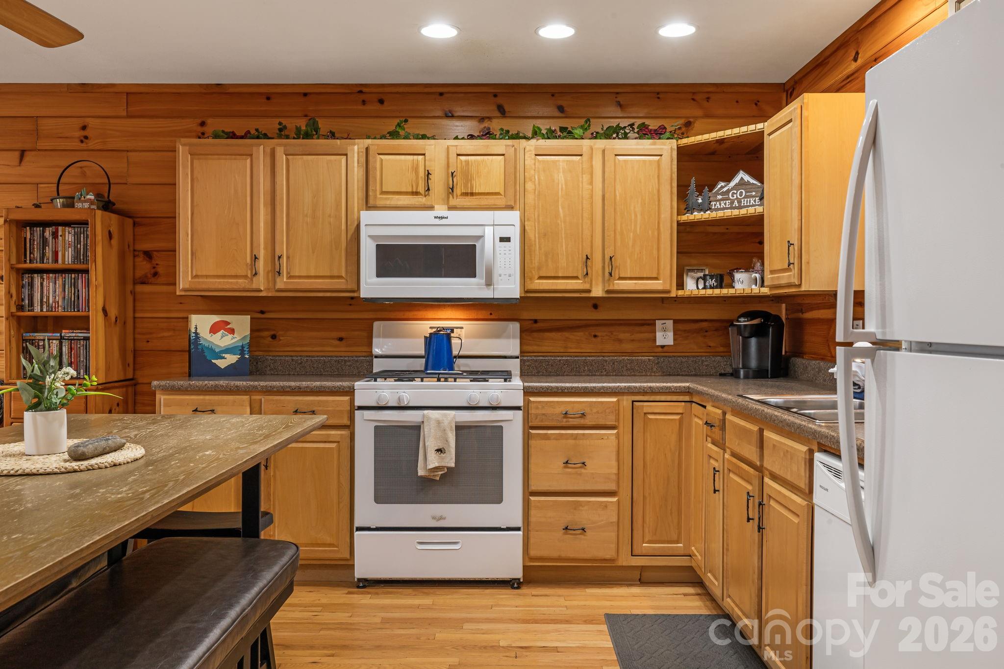 157 Crosspatch Lane Bryson City, NC 28713 - Photo 12 of 38 a kitchen with stainless steel appliances granite countertop a sink and cabinets
