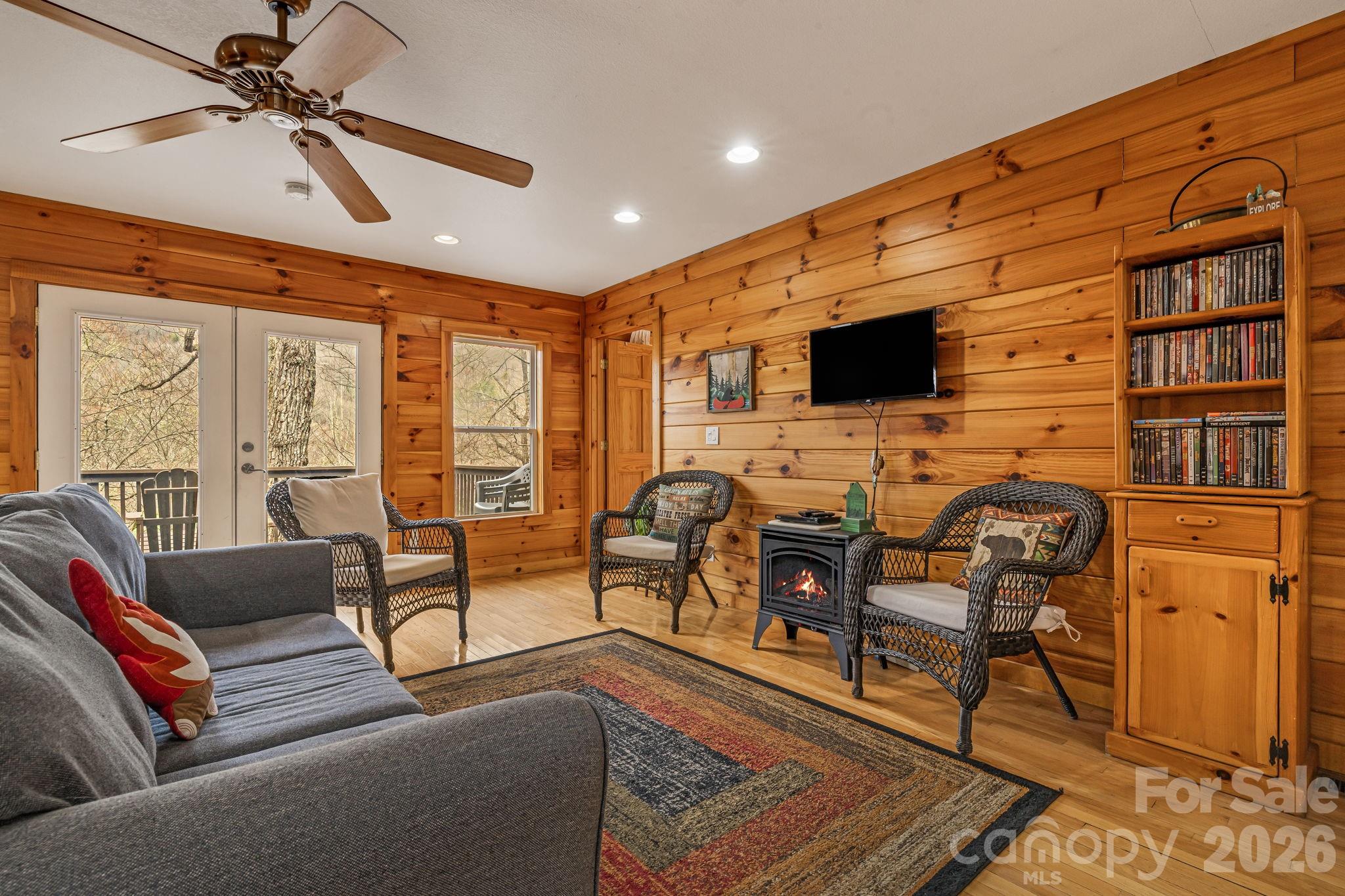 157 Crosspatch Lane Bryson City, NC 28713 - Photo 16 of 38 a living room with furniture and a flat screen tv