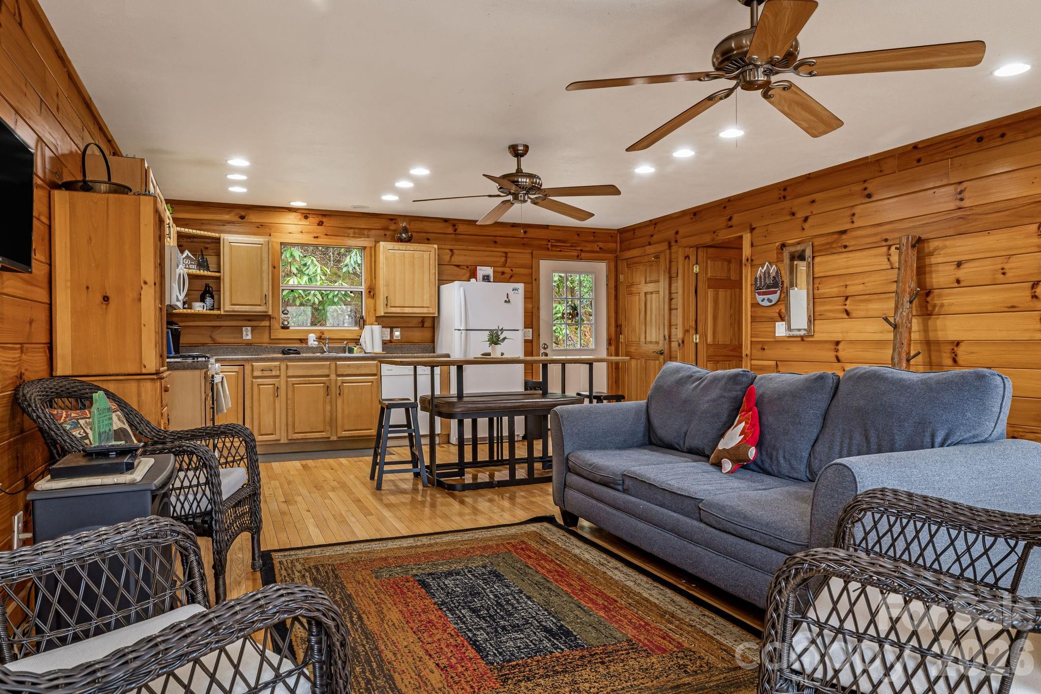 157 Crosspatch Lane Bryson City, NC 28713 - Photo 17 of 38 a living room with furniture a ceiling fan and a rug