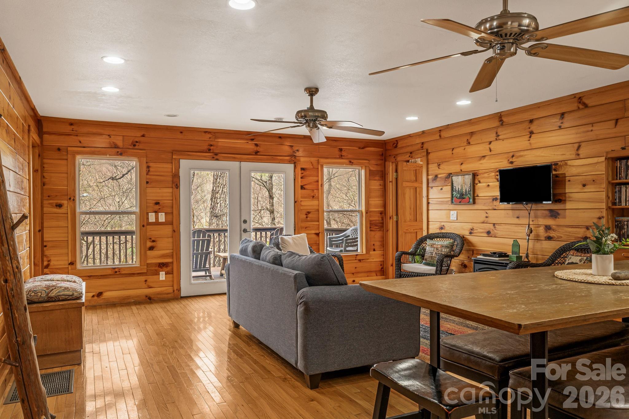 157 Crosspatch Lane Bryson City, NC 28713 - Photo 18 of 38 a living room with furniture a flat screen tv and a large window