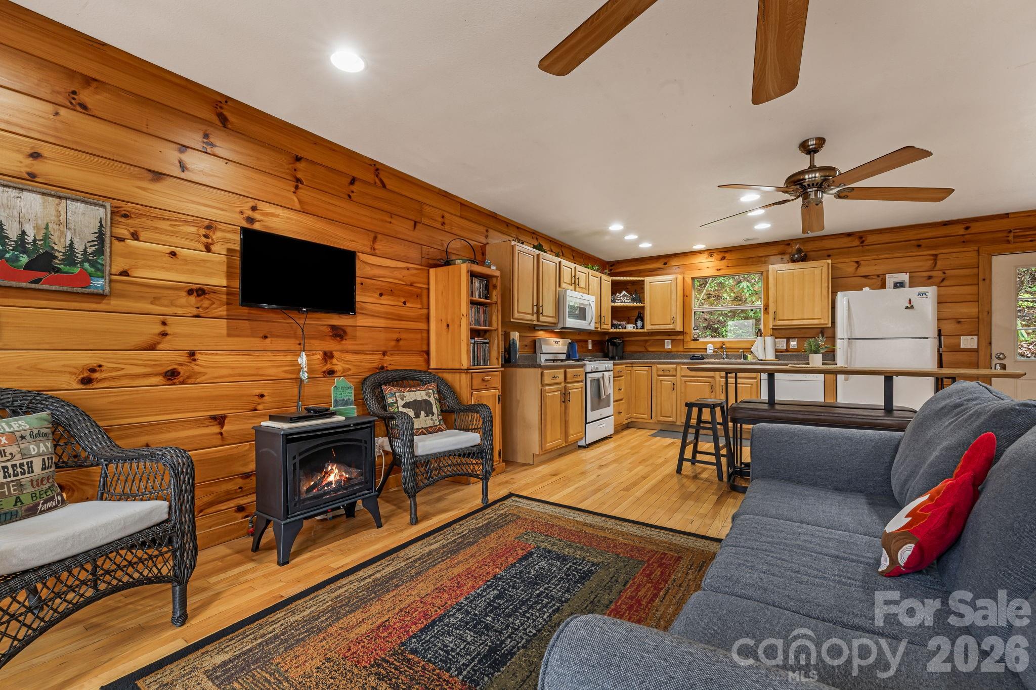 157 Crosspatch Lane Bryson City, NC 28713 - Photo 19 of 38 a living room with furniture and a flat screen tv