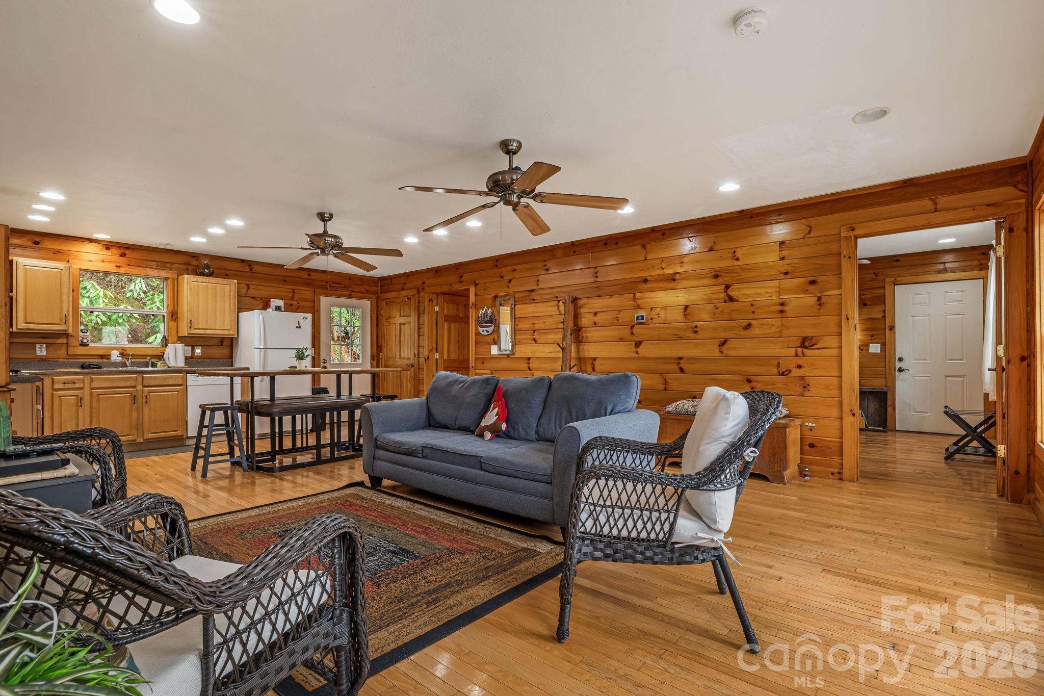 157 Crosspatch Lane Bryson City, NC 28713 - Photo 21 of 38 a living room with furniture a ceiling fan and a rug
