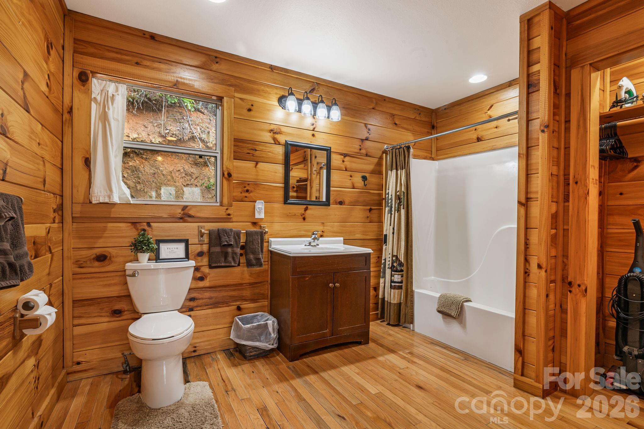 157 Crosspatch Lane Bryson City, NC 28713 - Photo 22 of 38 a bathroom with a toilet sink and mirror
