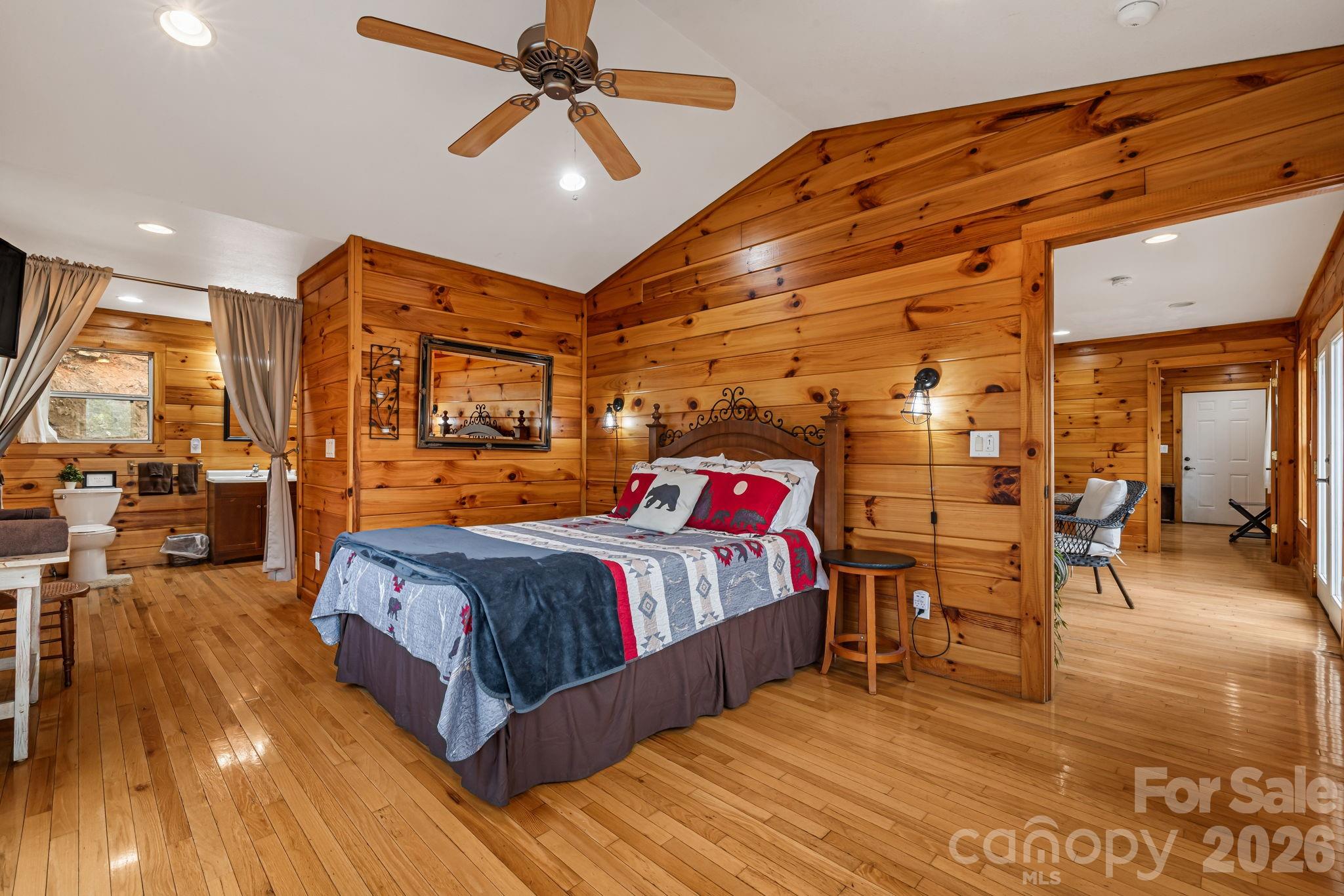 157 Crosspatch Lane Bryson City, NC 28713 - Photo 26 of 38 a bedroom with a bed and wooden floor