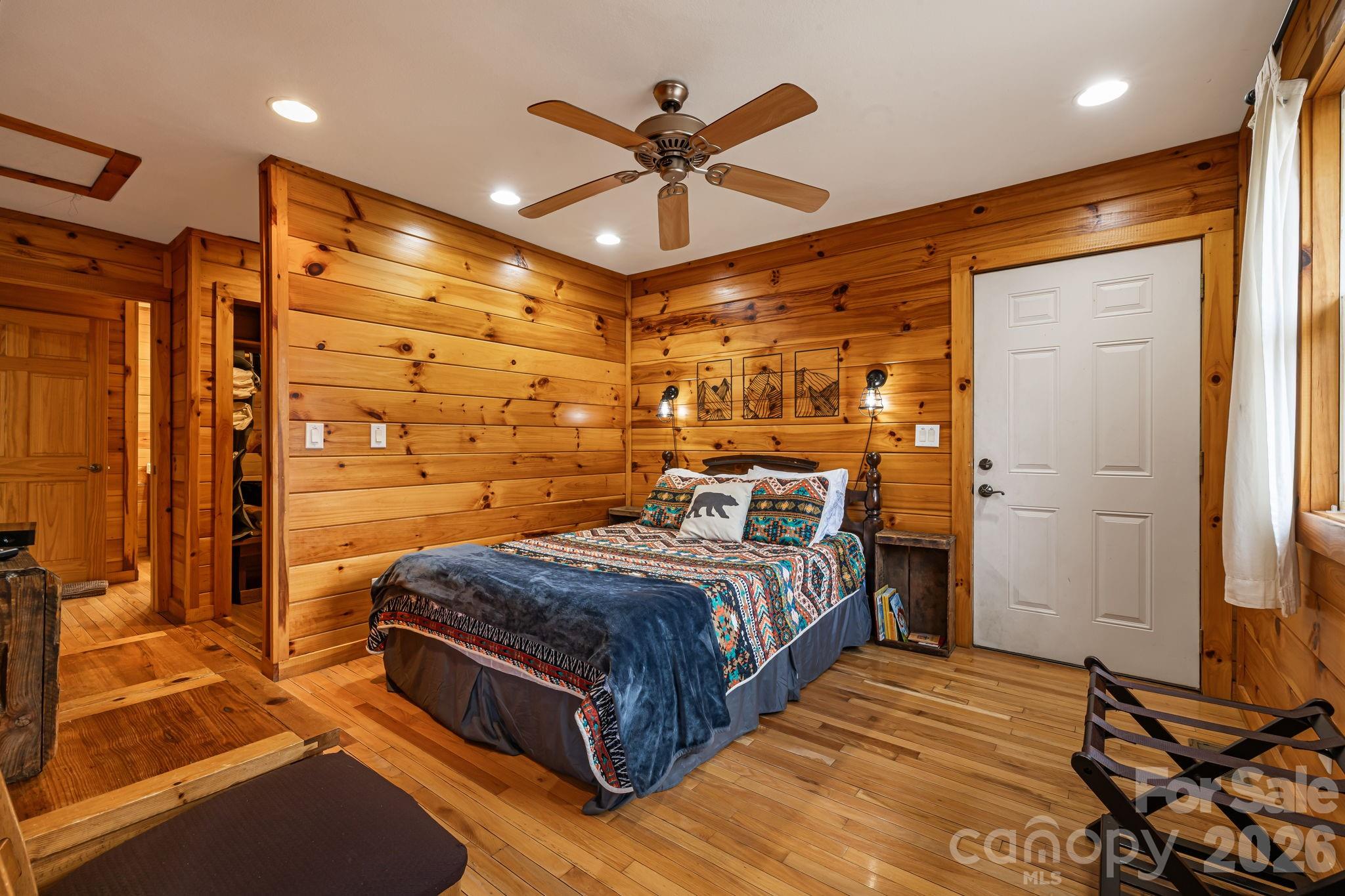 157 Crosspatch Lane Bryson City, NC 28713 - Photo 29 of 38 a bedroom with a bed and a ceiling fan