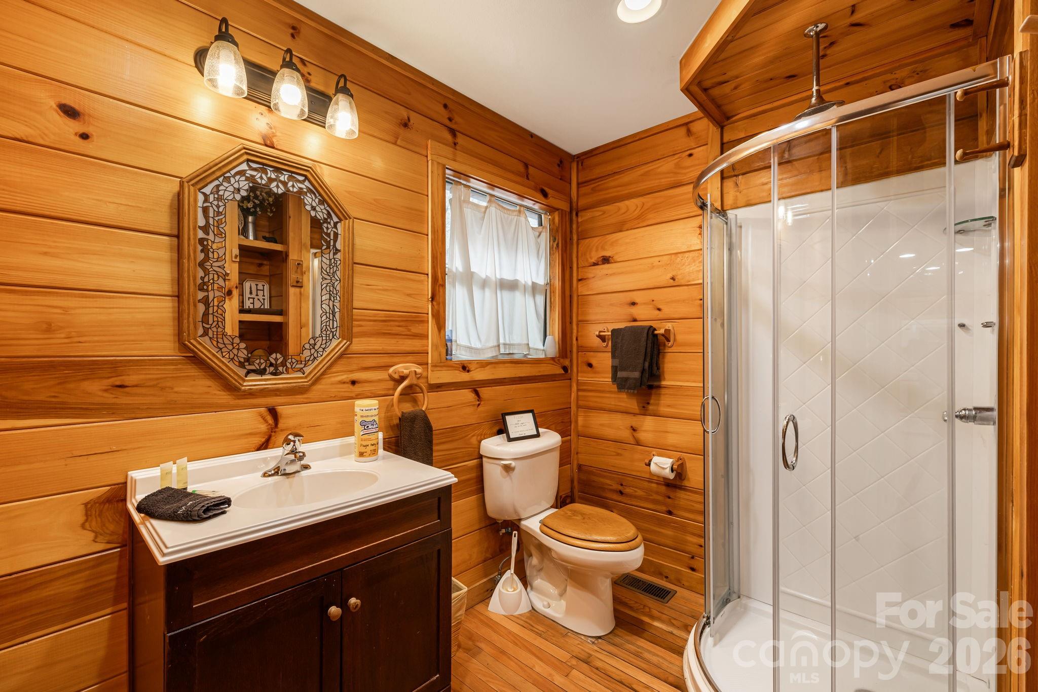 157 Crosspatch Lane Bryson City, NC 28713 - Photo 30 of 38 a bathroom with a toilet sink and mirror