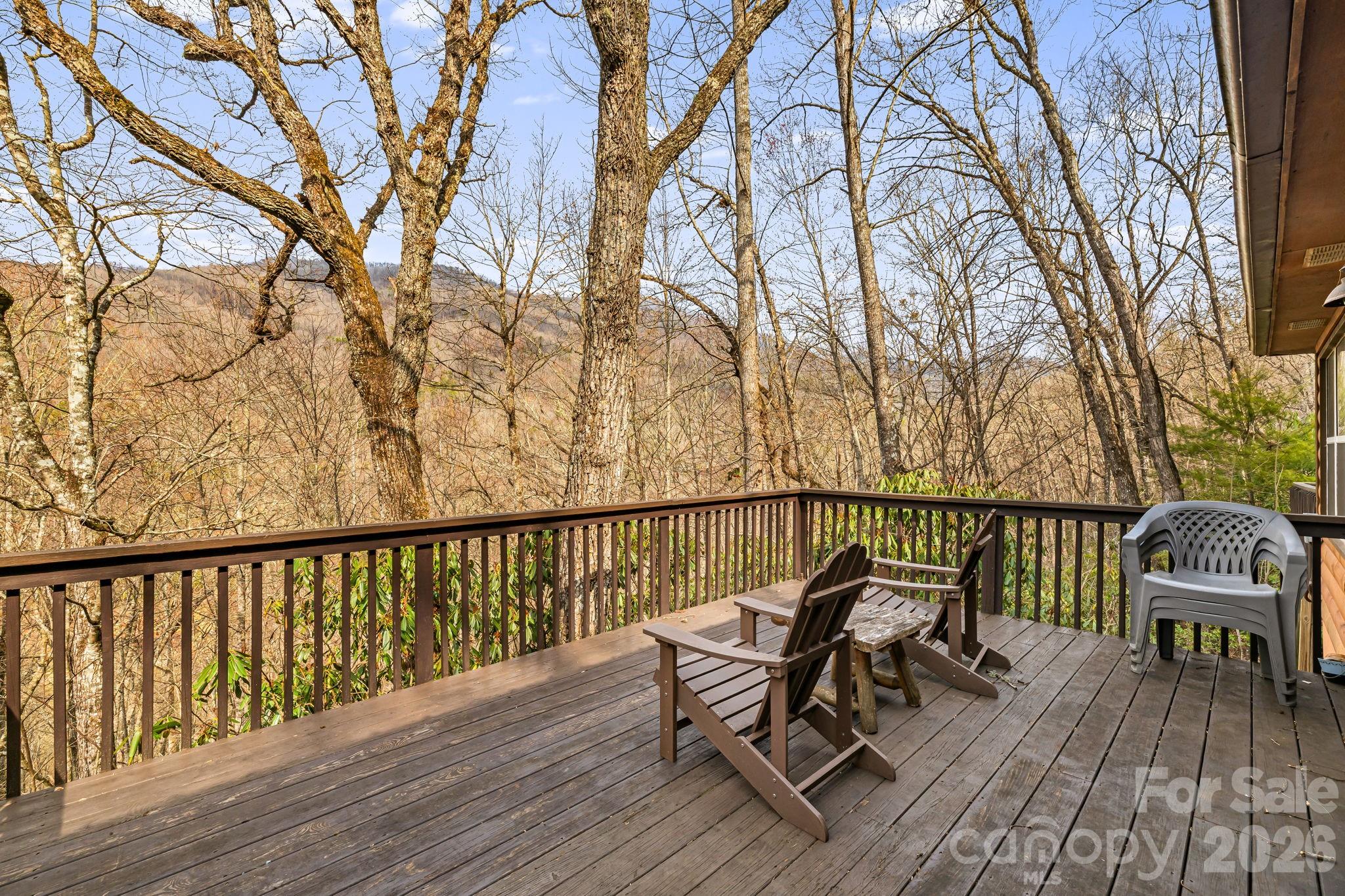 157 Crosspatch Lane Bryson City, NC 28713 - Photo 6 of 38 a view of a balcony with two chairs and a table