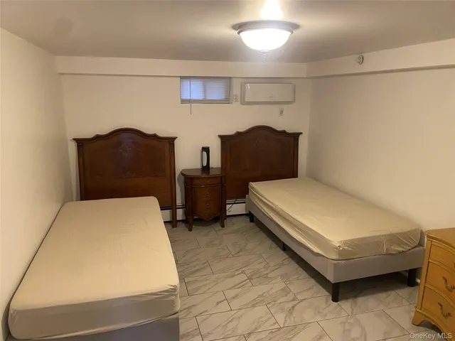 a bedroom with a bed and dresser