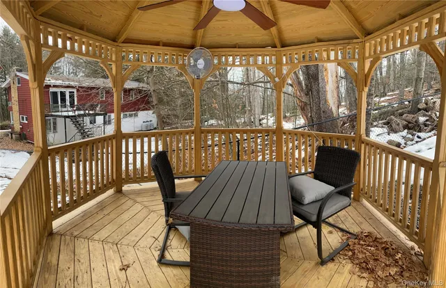 a view of balcony with wooden floor