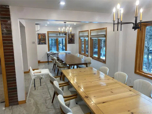 a dining room with furniture and window