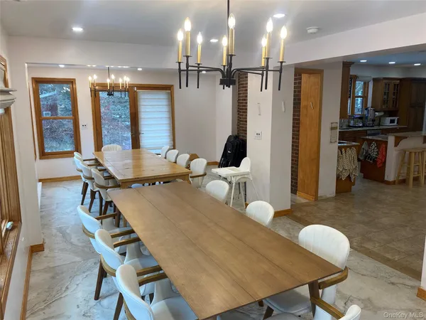 a dining room with furniture and wooden floor
