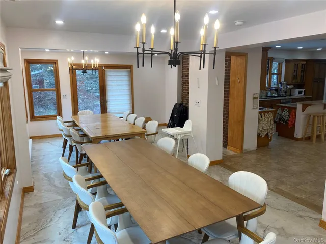 a dining room with furniture and wooden floor