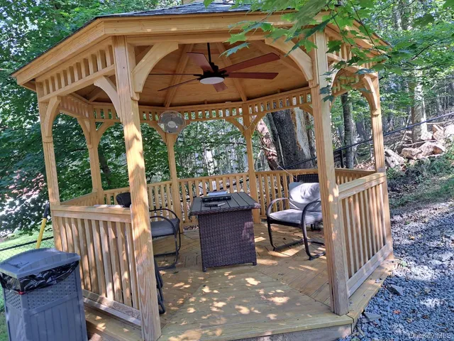 a view of a patio with a table and chairs