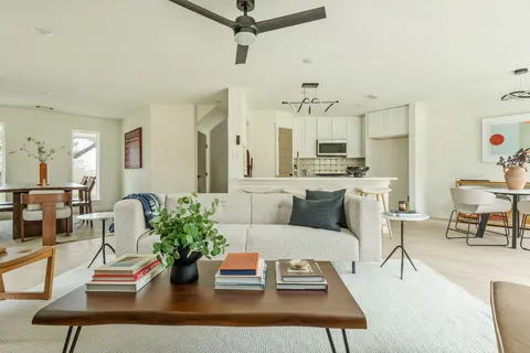 a living room with furniture and a table