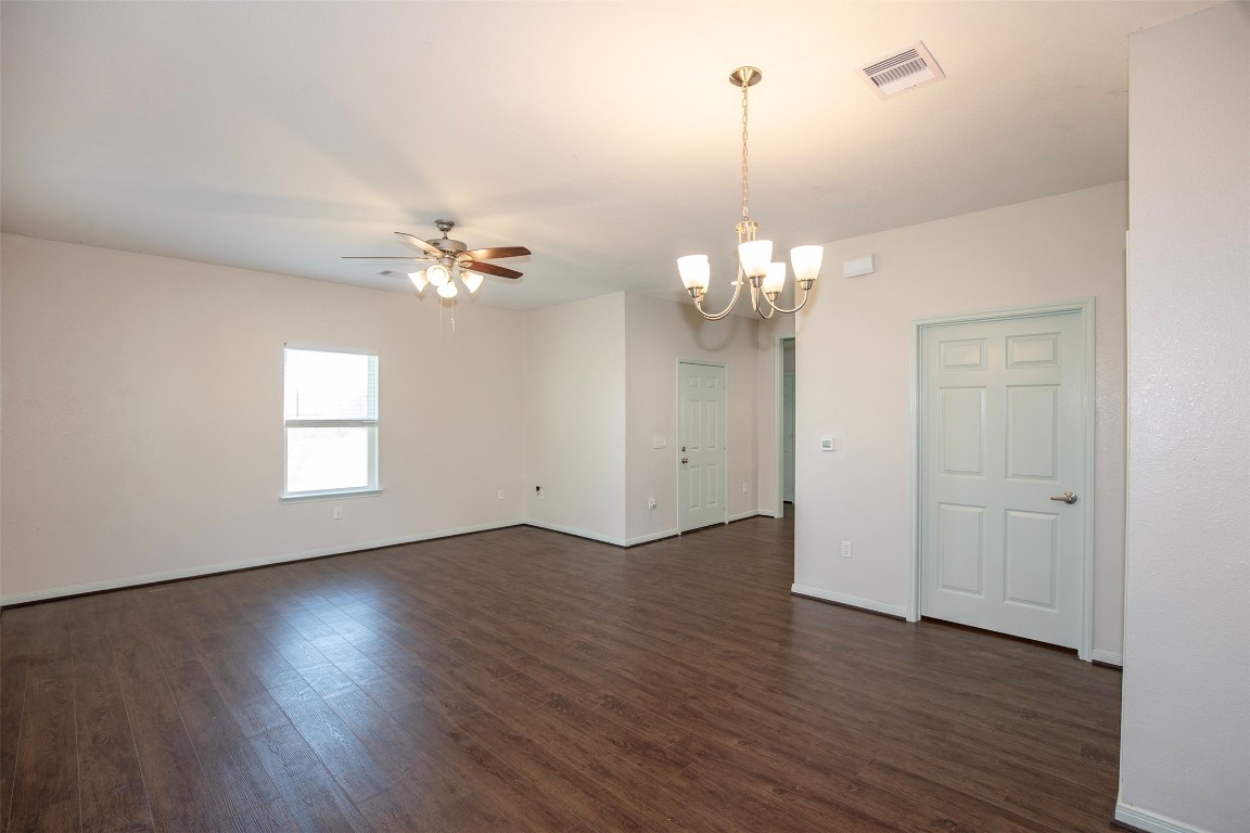 2016 H Avenue Dickinson, TX 77539 - Photo 13 of 30 a view of a room with wooden floor and chandelier