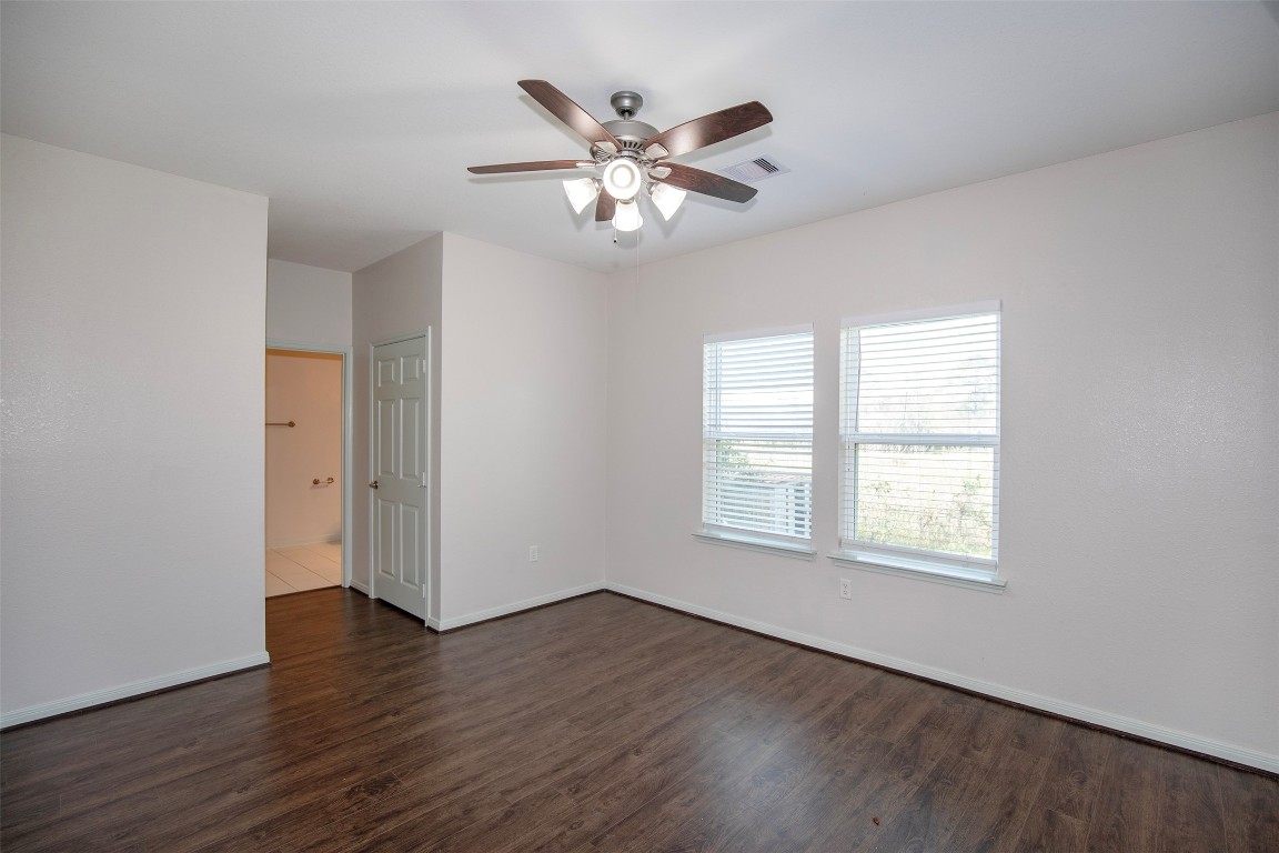 2016 H Avenue Dickinson, TX 77539 - Photo 18 of 30 a view of an empty room with wooden floor and a window
