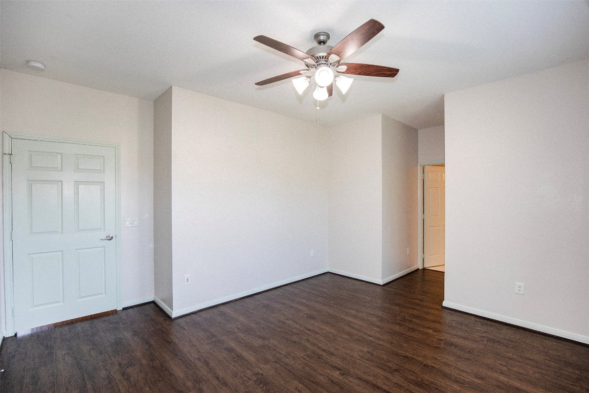 2016 H Avenue Dickinson, TX 77539 - Photo 19 of 30 an empty room with wooden floor and windows