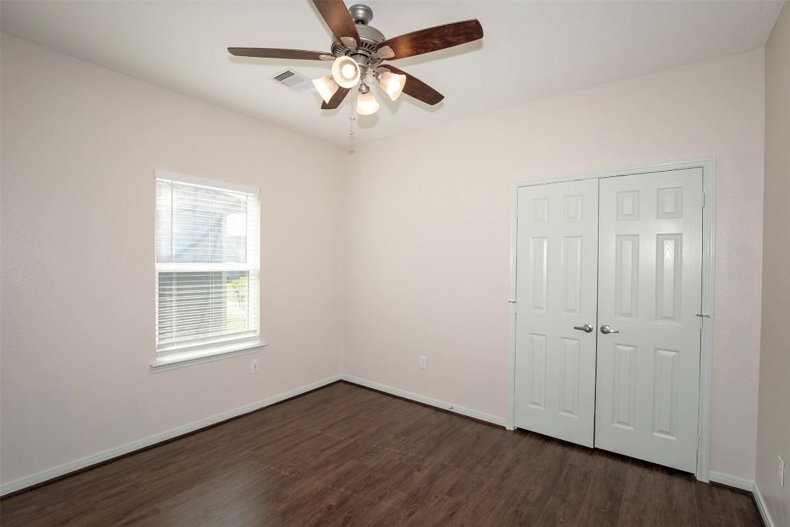 2016 H Avenue Dickinson, TX 77539 - Photo 23 of 30 a view of an empty room with wooden floor and a window