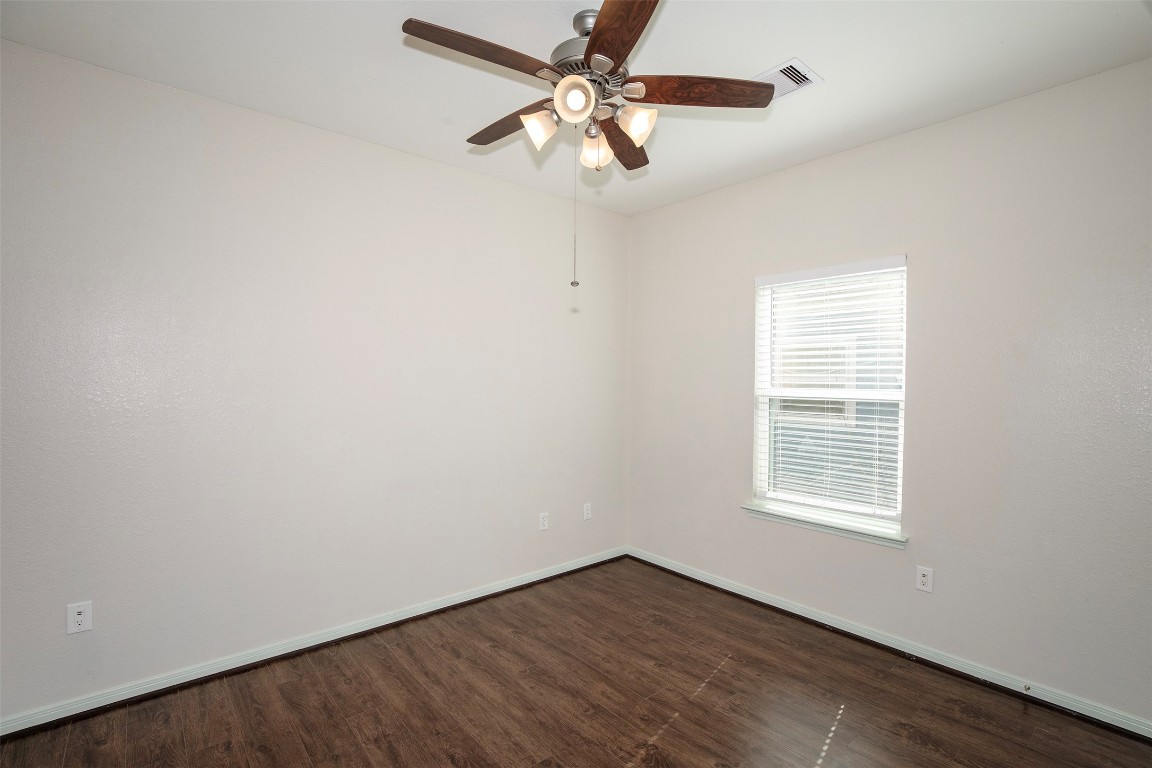 2016 H Avenue Dickinson, TX 77539 - Photo 27 of 30 an empty room with a window and a fan