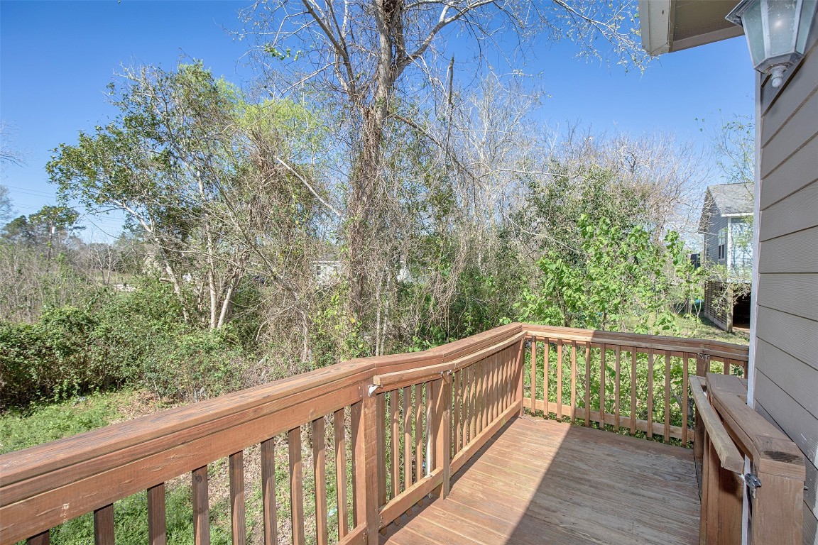 2016 H Avenue Dickinson, TX 77539 - Photo 29 of 30 a view of a balcony with wooden floor and fence