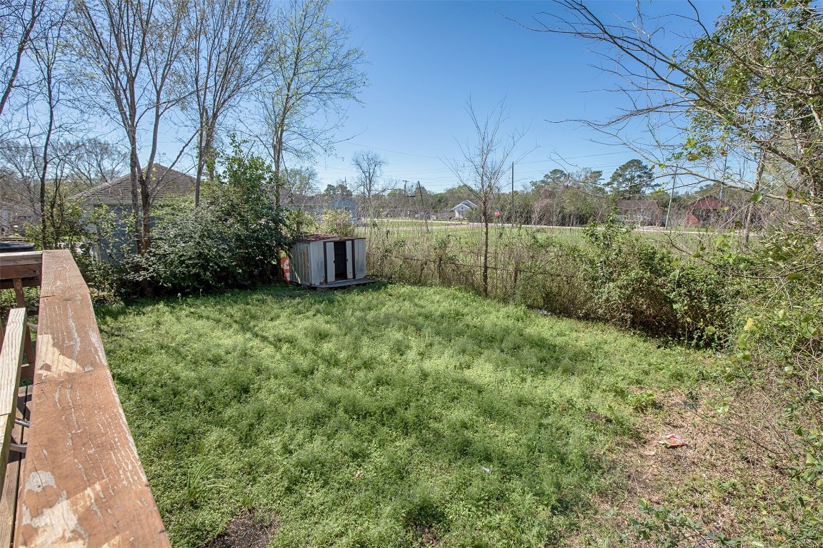 2016 H Avenue Dickinson, TX 77539 - Photo 30 of 30 a view of a backyard with potted plants and large trees