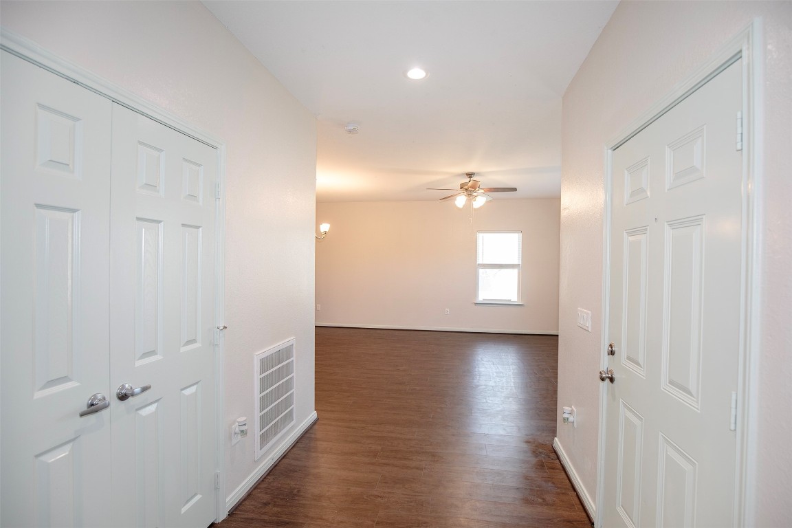 2016 H Avenue Dickinson, TX 77539 - Photo 7 of 30 wooden floor in a hall with an entryway