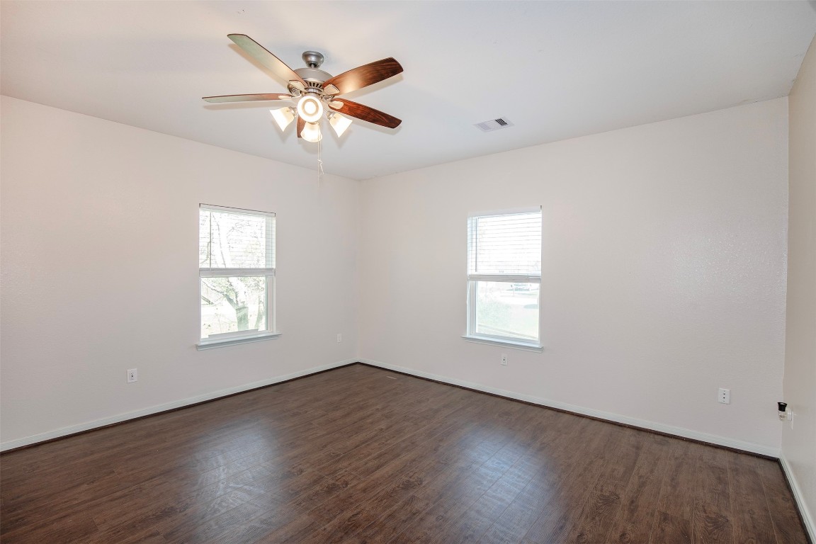 2016 H Avenue Dickinson, TX 77539 - Photo 8 of 30 a view of an empty room with wooden floor and a window