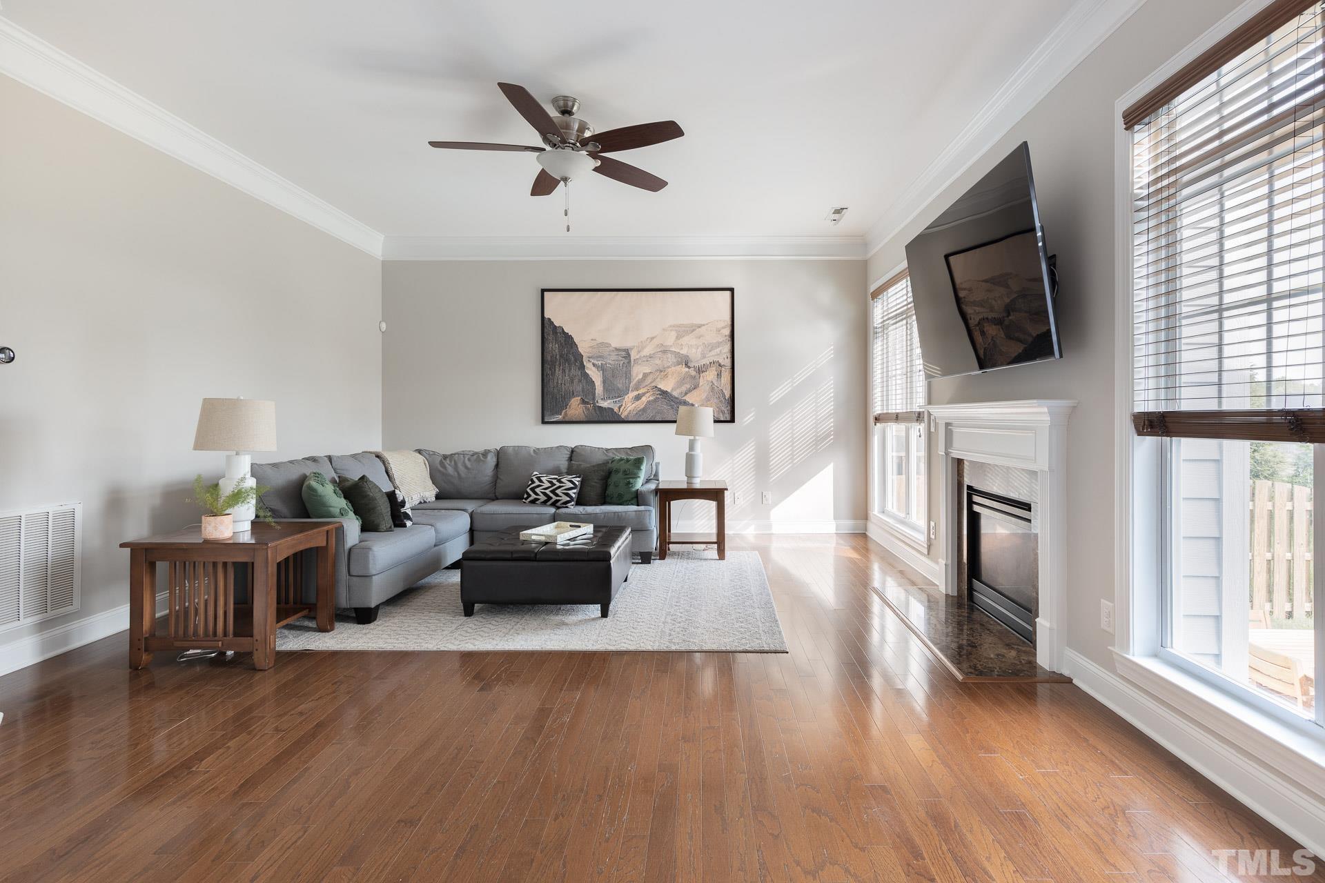 1148 Chapanoke Road Raleigh, NC 27603 - Photo 14 of 47 a living room with furniture fireplace and flat screen tv
